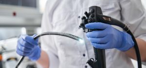 doctor holding endoscope